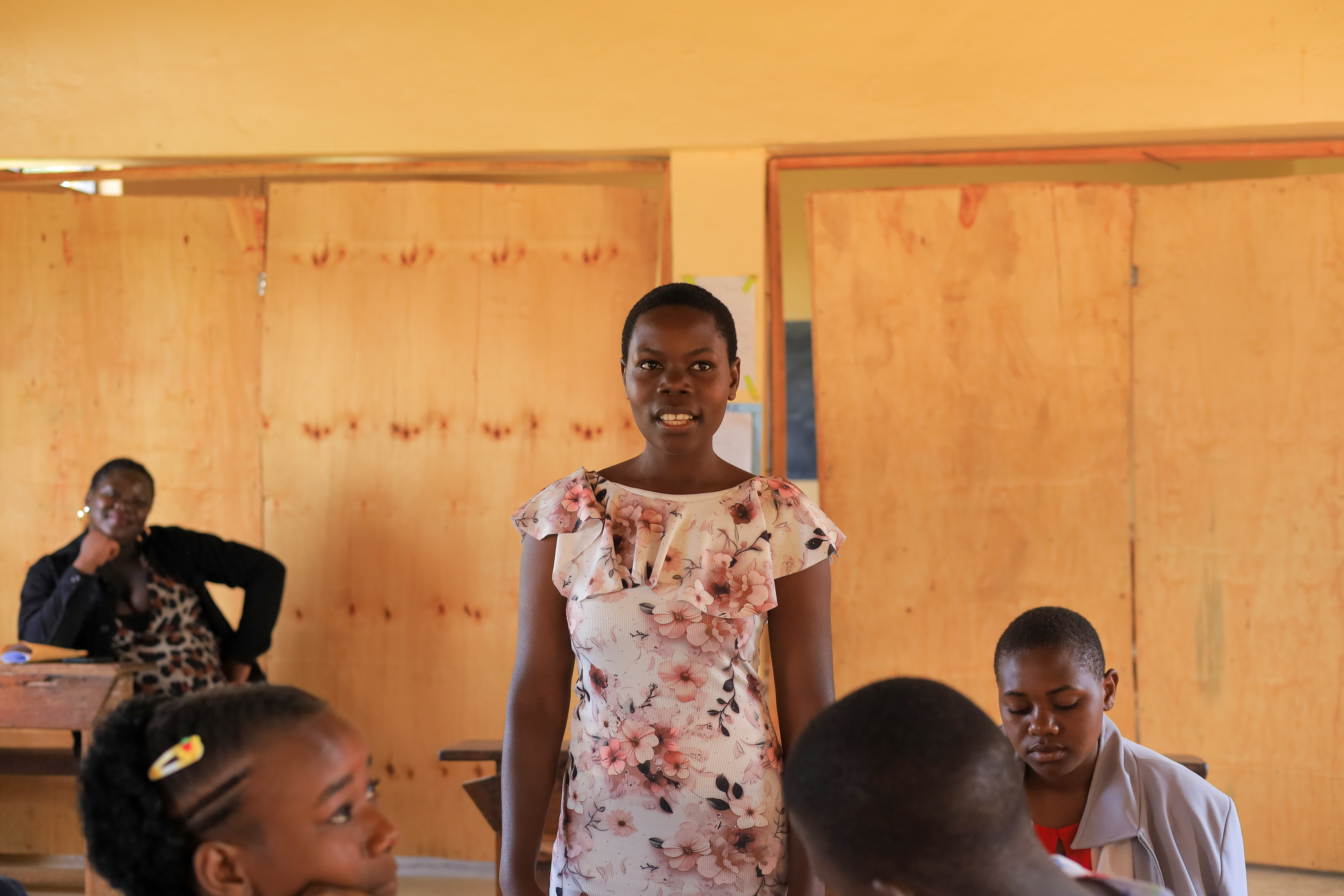 Group photo of SCALE team and partners in a classroom setting